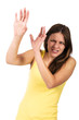Young woman in a yellow dress protecting her face
