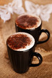 hot frothy drink cappuccino chokolate dusted, white paper butter hot frothy drink cappuccino chokolate dusted, white paper butter