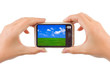 Camera with nature picture in hands Camera with nature picture in hands