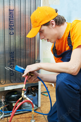 Photo: repair work on fridge appliance repair work on fridge appliance