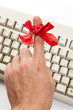Red bow on finger