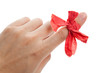 Red bow on finger