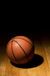 Photo: Basketball sitting on wood floor Basketball sitting on wood floor