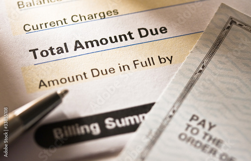 Photo: Credit card statement and check Credit card statement and check