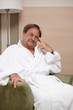 Happy elderly man in armchair