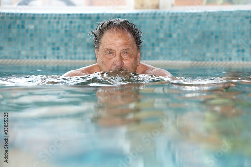 Photo: Elderly man at swimming pool Elderly man at swimming pool