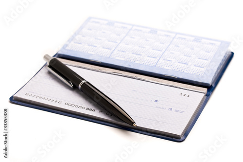 Photo: Writing checks and paying the bills Writing checks and paying the bills