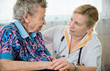 Senior woman with her home caregiver