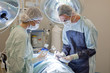 Medical doctor performing an operation on patient