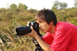 photographer taking photo in country side