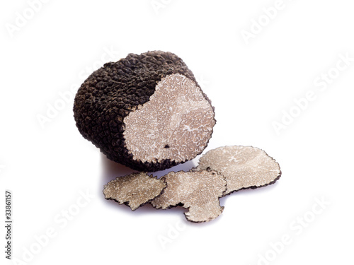 Photo: slice black truffle on white background slice black truffle on white background