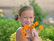 Girl with Orange Flowers on Her Fingers
