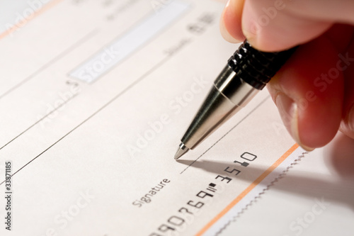 Photo: Writing a check Writing a check