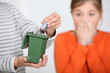 Closeup of a boy putting a battery in a miniature bin