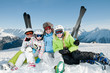 Ski, snow, sun and fun - happy family on ski Ski, snow, sun and fun - happy family on ski