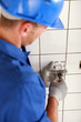 Man fitting a two pin electric socket