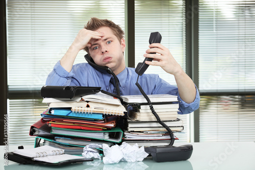 Photo: Office worker overworked Office worker overworked