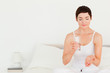 Charming woman taking pills