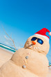 Sandman On Beach With Copyspace In Sky