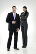 Photo: confident smiling businessman and businesswoman confident smiling businessman and businesswoman