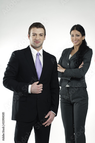 Photo: confident businessman and businesswoman confident businessman and businesswoman