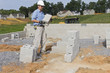 Mason with Concrete Block