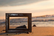 Frame on the beach at sunset