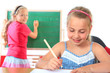 education , girl writing on blackboard