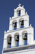 Bell tower against blue sky. Oia, Santorini island, Cyclades, Gr