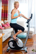 woman on stationary bicycle