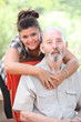 Grandad or grandpa with smiling happy grandaughter