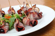 Baked prunes in bacon Baked prunes in bacon