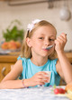 girl eating yoghurt