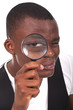 Man holding magnifying glass