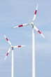 Wind turbine in blue sky.