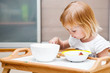 A small girl is eating