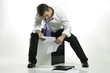Photo: bankrupt businessman looking at business report bankrupt businessman looking at business report