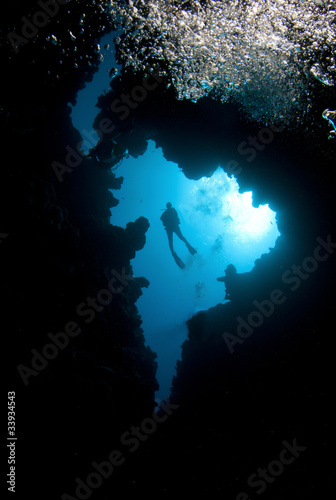Photo: Scuba diver shilouetted in canyon Scuba diver shilouetted in canyon