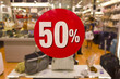Fifty percent off sale on a shop window.