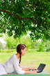 Young woman smiling notebook bench tree park