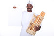 Baker with a basket of baguettes