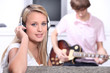 Teenagers listening to music on headphones