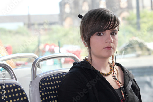 Photo: Girl sitting on the bus Girl sitting on the bus