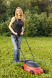 Photo: woman mowing with lawn mower woman mowing with lawn mower