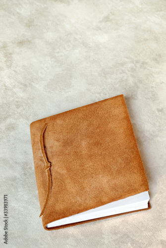 Photo: Suede Book on Marbled Background Suede Book on Marbled Background