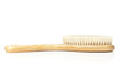 A brown woodem hairbrush