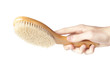 A brown woodem hairbrush