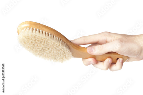 Photo: A brown woodem hairbrush A brown woodem hairbrush
