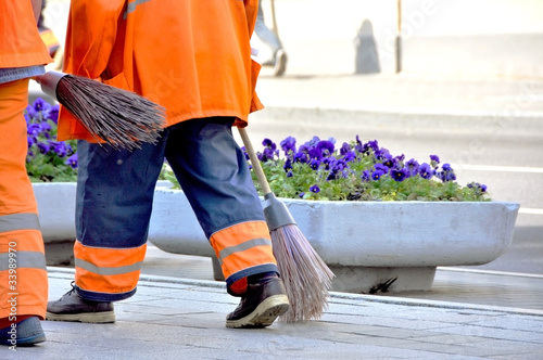 Photo: Street cleaners infront of flowers Street cleaners infront of flowers