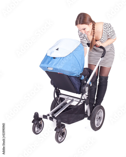 Photo: young beautiful mother with baby buggy (stroller) young beautiful mother with baby buggy (stroller)